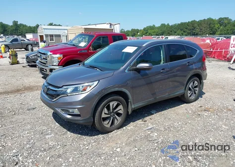 2016 Honda Cr-V Touring z USA, uszkodzony, nr VIN 5J6RM4H97GL097321
